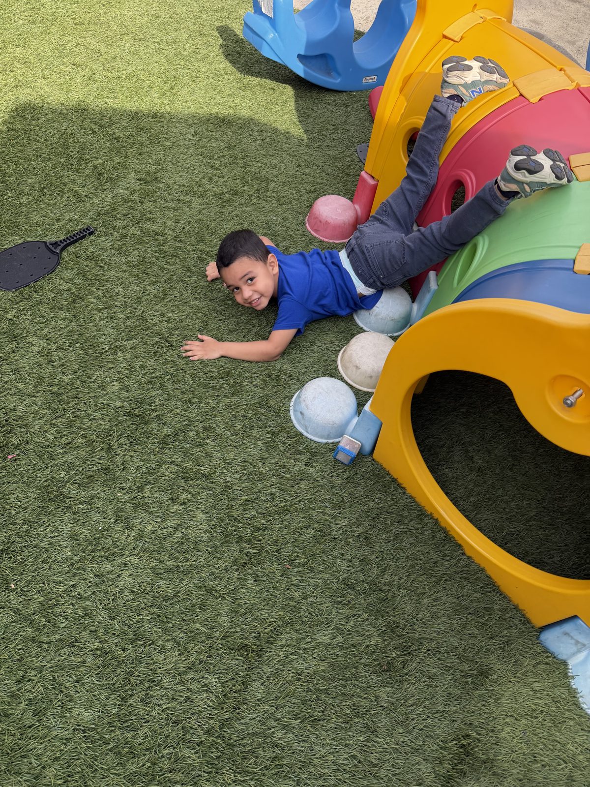 Boy playing on the outdoor playground