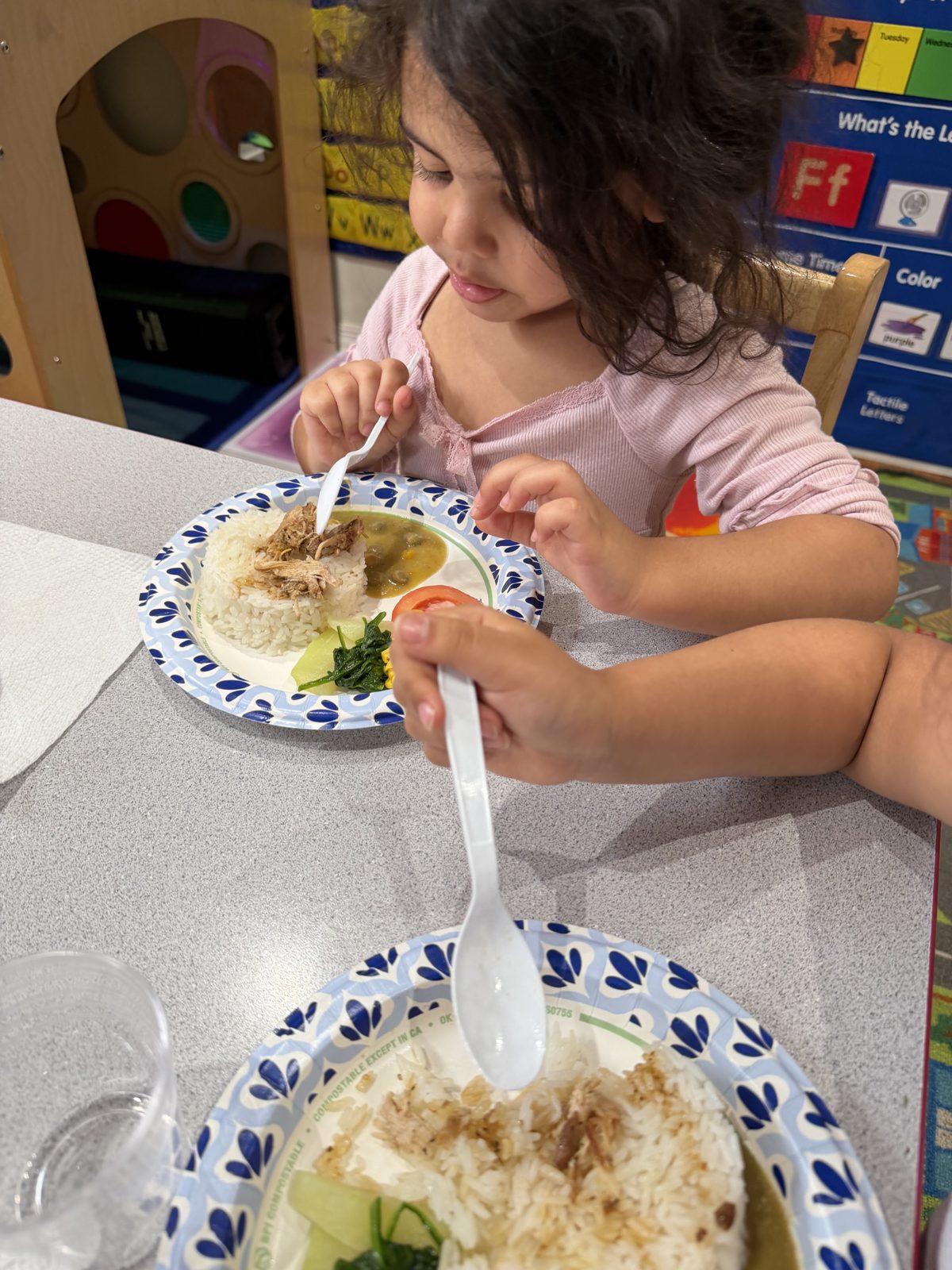 Child enjoying a healthy home-cooked lunch