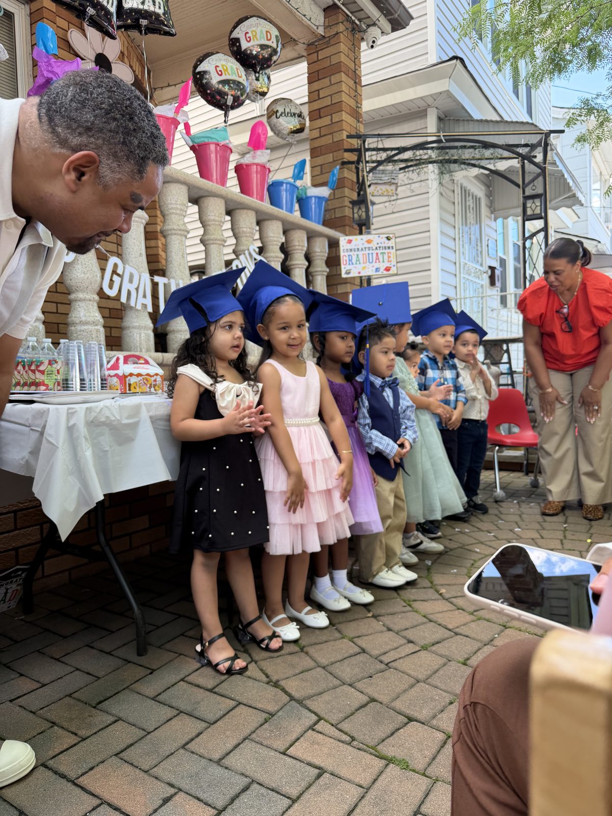 Children in graduation caps at the annual graduation ceremony